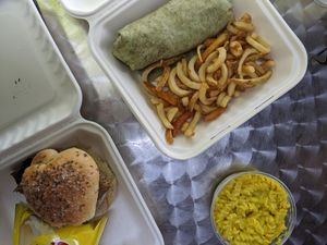 Vegan breakfast burrito with curly fries, vegan Mac, vegan beef on weck at Caffe at Amy's in Buffalo