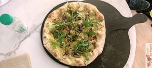 Vegan pizza, "la truffe", olive oil base, truffle cream, mushrooms, shredded vegetables, arugula at La Pizza de Nico in Paris