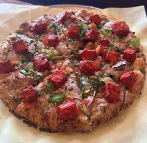 Chick'n curry pizza with curry sauce at Fusion Curry Pizza in Portland