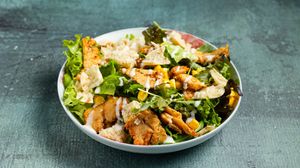 Caesar's salad with green lola lettuce, plant based chicken, cheese, sweet corn, croutons and Caesar's sauce at Handwich in Athens