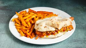 PLUS Hot dog Handwich with handame sausage from lentils and chickpeas, mayonnaise, coleslaw, crispy onions, ketchup, mustard and crunchy fries  at Handwich in Athens