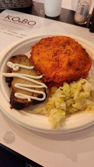 Eggplant Parmesan, seitan steak and cabbage at Ko.bo Vegan in Milan