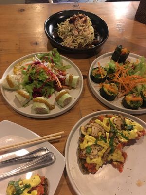 Spring rolls, sushi, mushroom pizza & zoodles at Rasayana Raw Food Cafe in Bangkok