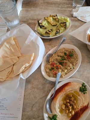 Skordalia, baba ghannouj and hummos with vegan pita at Cafe Athena in San Diego