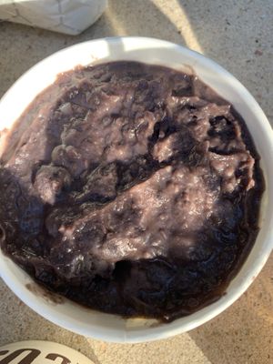 Refried black beans  at Tacos A Go Go - Midtown in Houston