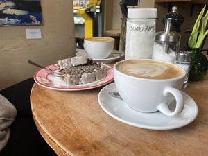 Vegan cake with a large cappuccino with oatmilk  at Cafe Glückskind in Kiefersfelden