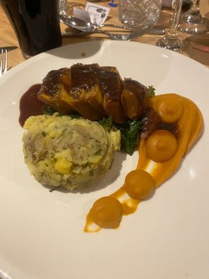 Sesame crusted tofu, smashed potatoes, carrot and parsnips and vegan gravy at The Clock House Bistro in Ballymena