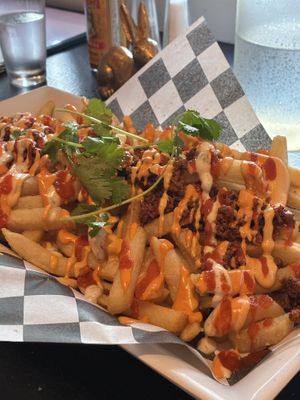 Loaded fries!!! A little spicy (which I like). Lots of sauce (which I like)  at Mad Rabbit Cafe in Madison