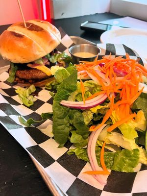 Desert Cottontail burger with side saladd  at Mad Rabbit Cafe in Madison