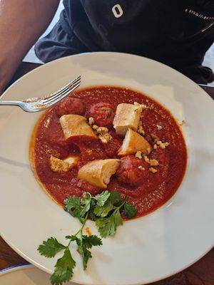 Harissa Shakshuka (vegan). Tofu & mushroom balls, spiced melted tomato sauce, walnut, sourdough at SkinnyTom's Deli in Unawatuna