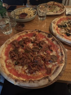 vegan pepperoni pizza with added bbq jackfruit  at Nourish - Uluwatu in Pecatu