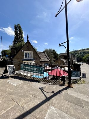 Building is the old Porter’s Lodge, built 1837. One back window even has bars on it from back when it was a prison cell!  at Roast & Toast Cafe in Sowerby Bridge