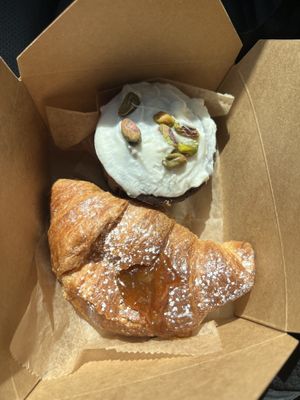 Vegan croissant with apricot jam and a vegan chocolate raspberry pistachio cupcakee  at Linda's Dolci in Albuquerque