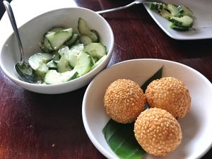 Cucumber salad, sesame sticky rice balls with sweet filling - all vegan at Leaf Vegetarian in Rotterdam