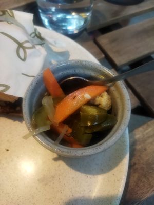 La torta viene acompañada de chilitos en vinagre at Alguito Vegano in Mexico City