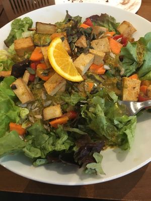 Large salad with tofu and curry-mustard dressing. Delicious and filling portion! at Katzentempel - München in Munich