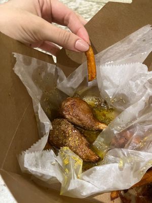 Lemon pepper vegan wings with sweet potato fries.  at ON THE RUN Vegan in Miami