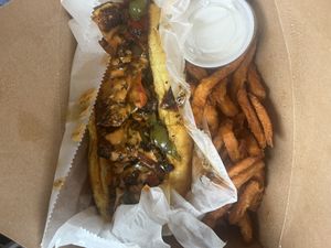  Philly cheese steak sandwich (no soy in the meat alternative they make in house🤩) with sweet potato fries and a delicious sweet sauce for the fries 9/10   at ON THE RUN Vegan in Miami