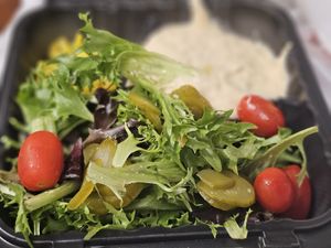 Side salad with hummus that comes with the combo. Balsamic vinaigrette is the only vegan dressing offered. at Urban Grill & Salad in Rancho Cordova