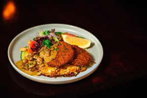 Crumbed Eggplant
served with mushroom, basil cream sauce or tomato, mushroom and olive ragu, rosti potato and salad (v, vg) at Avalon Restaurant & Cocktail Bar in Katoomba