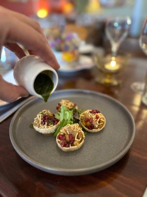 Pani Puri ~ crispy puffs filled with massaman mousse, chickpea, pomegranate, mint & coriander (vg) at Avalon Restaurant & Cocktail Bar in Katoomba
