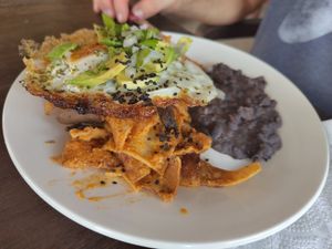 Chilaquiles rojo con huevo at Cafeteria Veggie Carimbó in Playa Zipolite