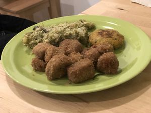 Seitan bites, croquette of vegetables and vegan cheese and broccoli with tahini at La Vegana in Ferrara