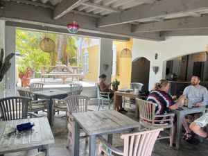 Outdoor yet covered seating  at Isabelle Off The Beach in Westpunt