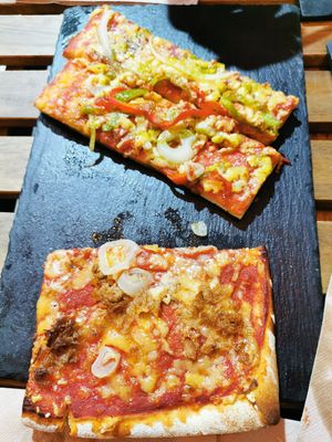 Pizza with fake mozzarella peppers onions and the other one with fake tuna and onions. Good! at Santoni - When food is the solution in Barcelona