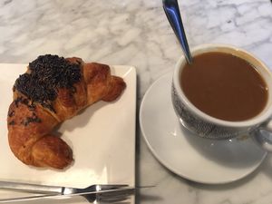 chocolate croissant and coffee at Santoni - When food is the solution in Barcelona