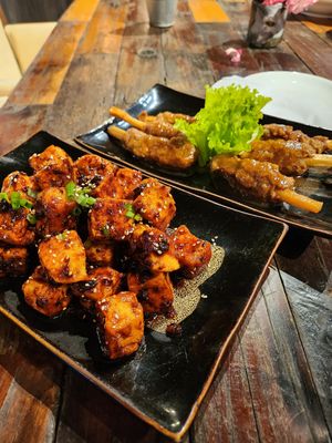 Spicy Gochujang Sesame Tofu and Vegan Chicken wings at Turtle Lake Brewing Company in Hanoi
