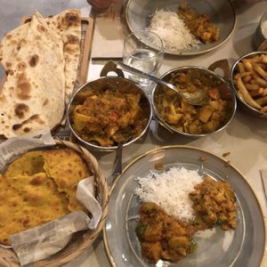 Selection of vegan curries and bread  at Trishna in Gozo