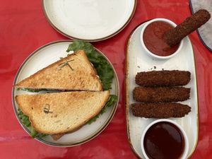 Tempeh BLT sandwich, mozzarella sticks, and dipping sauce  at Cooper's Co-op Cafe in Portland