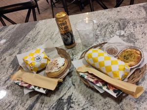 Medusa bagel 🥯 with banana cinnamon roll and godfather sub with quiche at Village Farmacy  in Poland
