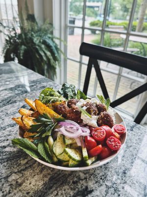 Friday Greek “Meatball” special. Of course to go orders are plated differently but loaded all the same with the goods. 😅😉 at Village Farmacy  in Poland