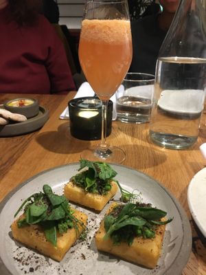 Chick pea chips with peas. Rovi Bellini in the background.   at ROVI in London