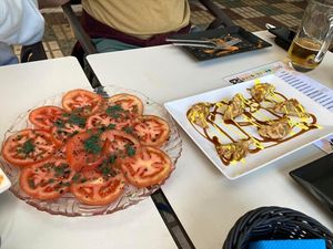 Tomato salad and gyozas (sauce on vegetable gyozas tasted a little like salted caramel, quite sweet)  at Coma Tapas & Punto in Huelva