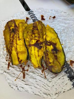 Aubergine fried in batter - batter tasted like it was based on chickpea flour, covered in what tasted like maple syrup. Very delicious.  at Coma Tapas & Punto in Huelva
