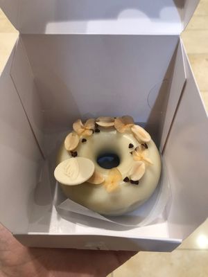 My very expensive donut! (Chocolate and peanut flavour with a white chocolate glaze).  at Angel Cakes - Yas Mall in Abu Dhabi