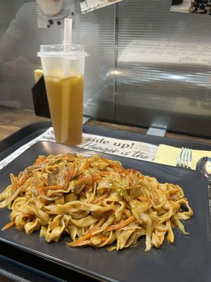 Fried noodles and iced jasmine green tea at Happy Veggie - 天街素食 in Budapest