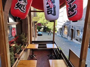 Outdoor seating at Omusubi Café in Geneva