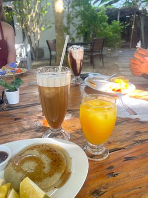 Pancakes, juice,  iced coffee vegan in front, iced coffee cowmilk/whipcream behind at Riviera Punta Cana in Punta Cana
