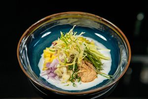 ซาวน้ำผลไม้ sao nahm pollamai
fermented rice noodle with coconut cream dressing, citrus, fruits, 
and dried prawns
 at Nahm  in Bangkok
