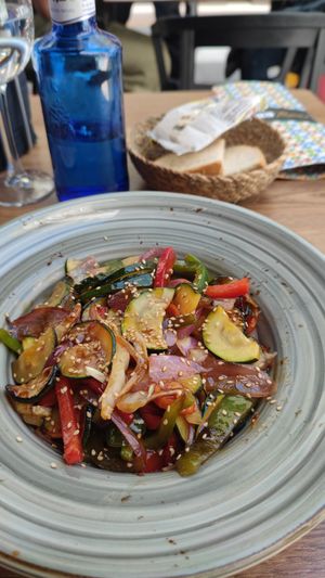sautéed veggies and boring bread in the back at Toro Tapas Ronda in Ronda