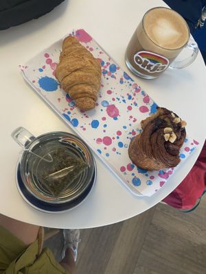 Freshly baked hazelnut chocolate bun and plain croissant - both fantastic! Oat cappuccino and Moroccan mint tea  at Okja - Kloof in Cape Town