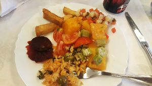 First plate at the buffet with beets, rice and veggies, okra, cooked squash, mixed veggies and fries. at Restaurante 1800 in Camaguey