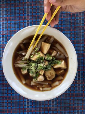 Macaroni-like curly noodle strips in soy sauce broth. Very tasty. Ordered from a photo, not sure what it’s called.   at Vegetarian for Healthy in Chiang Dao