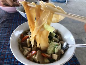 Luxuriously thick rice noodles in gravy with a generous portion of tofu and veggies, seasoned with white pepper. Very tasty!  at Vegetarian for Healthy in Chiang Dao