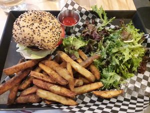 Burger, fries, and salad! All were delicious! at Invitation V in Montreal