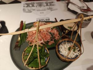 Lovely presentation of traditional rice noodle dish at Vegan Mahanakhon in Bangkok